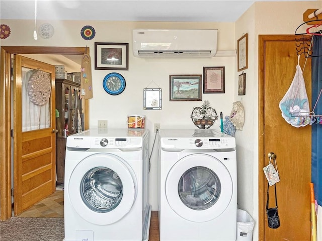 laundry room featuring washer and dryer and a wall unit AC