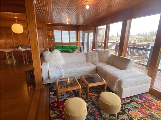 27 Beach Dr, Lake Tapawingo, MO 64015 - living room featuring wood ceiling, wood finished floors, and a healthy amount of sunlight