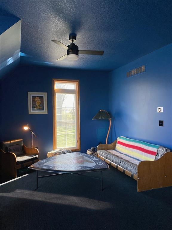 27 Beach Dr, Lake Tapawingo, MO 64015 - bedroom with a textured ceiling, a ceiling fan, and carpet floors