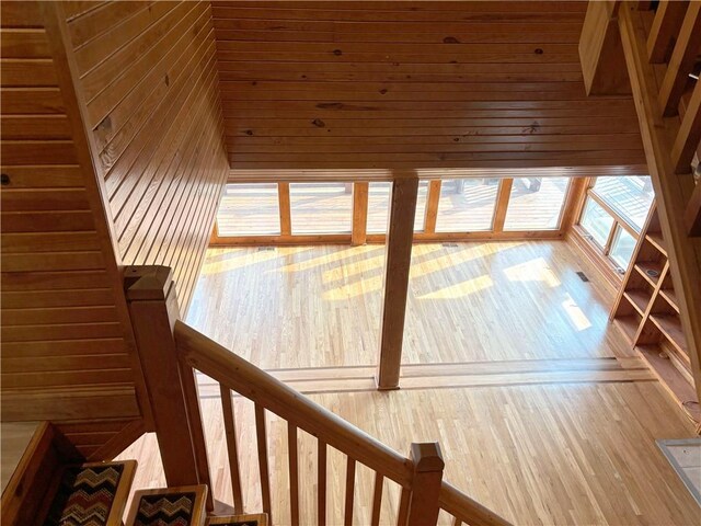 27 Beach Dr, Lake Tapawingo, MO 64015 - staircase with wood walls and wood finished floors