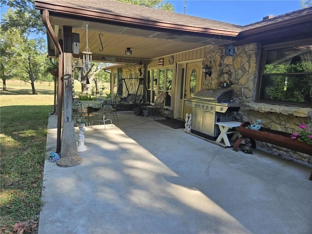 view of patio with a grill