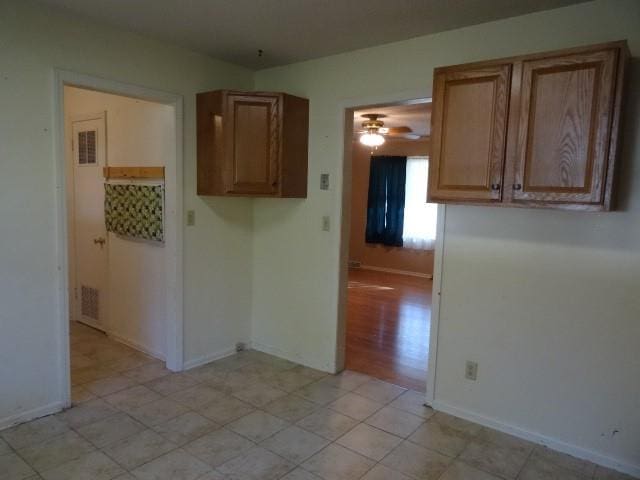 kitchen featuring light wood-type flooring and ceiling fan