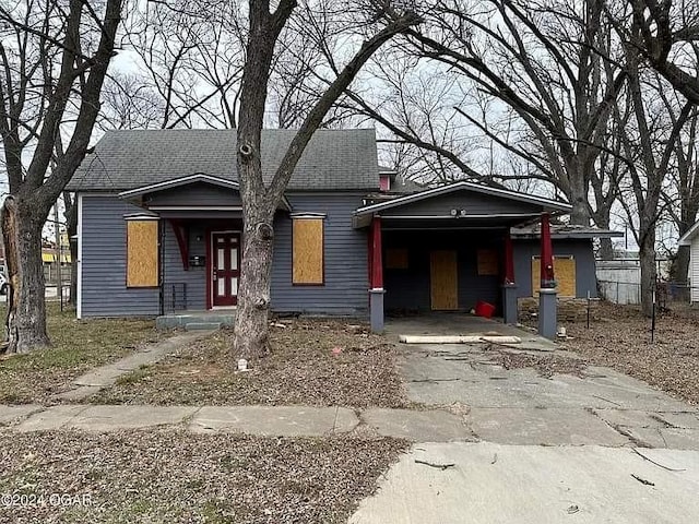 view of front of property with a carport