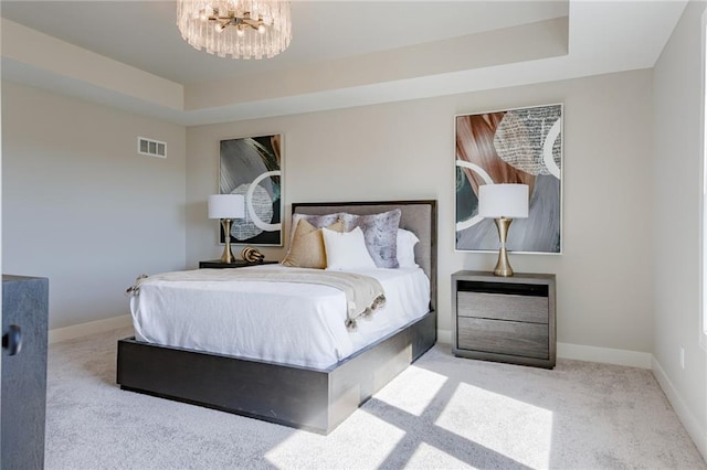 2202 W 178th Ter, Overland Park, KS 66085 - bedroom with carpet flooring, a tray ceiling, a chandelier, and baseboards