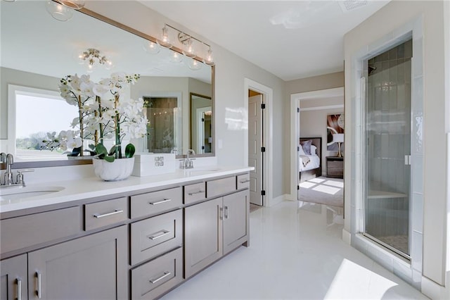 2202 W 178th Ter, Overland Park, KS 66085 - ensuite bathroom featuring a stall shower, double vanity, and tile patterned flooring