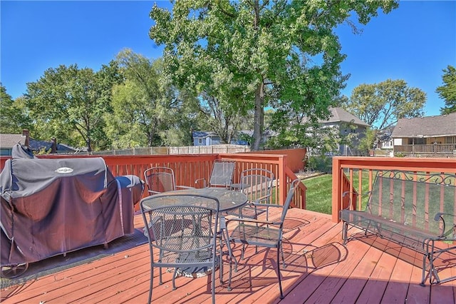 wooden deck featuring area for grilling