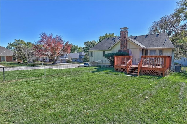 back of property featuring a yard and a deck