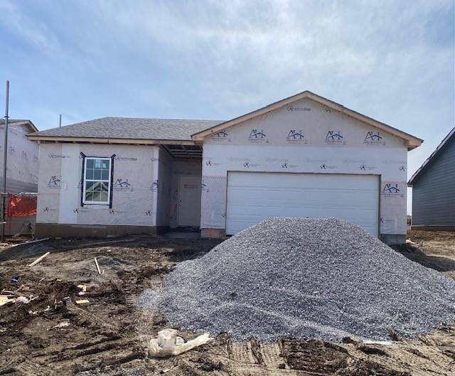 property in mid-construction with a garage and stucco siding