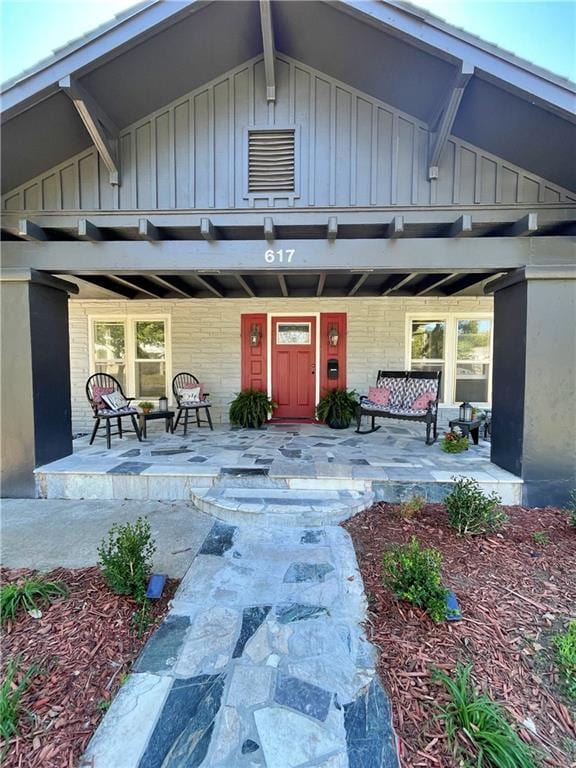 property entrance with a patio area