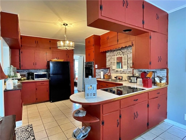 kitchen featuring a notable chandelier, light tile patterned floors, decorative backsplash, and black appliances