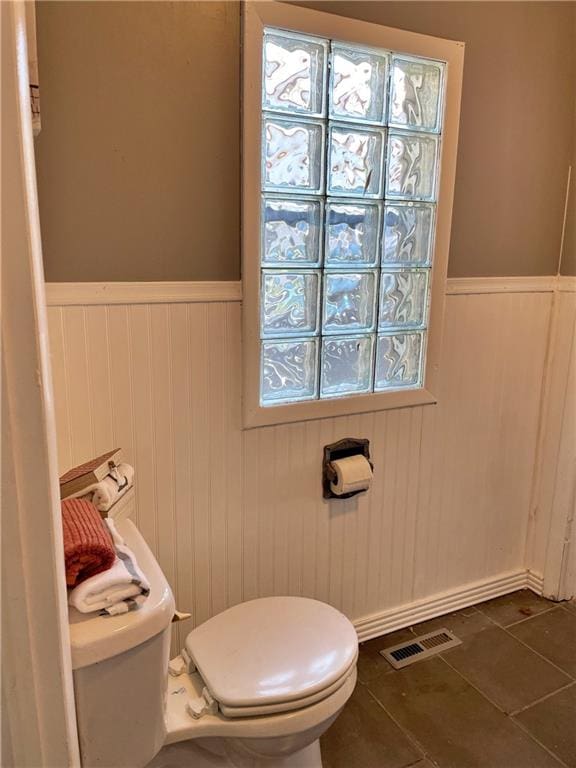 bathroom featuring tile patterned flooring and toilet