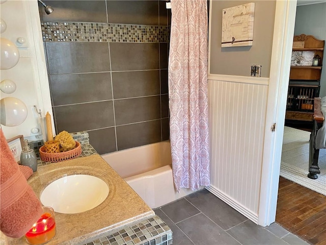 bathroom featuring shower / bath combo, hardwood / wood-style floors, and sink