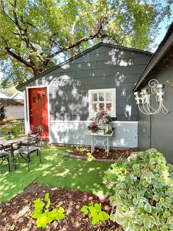 view of outbuilding featuring a yard