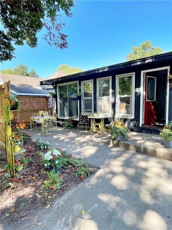 rear view of property featuring a patio area