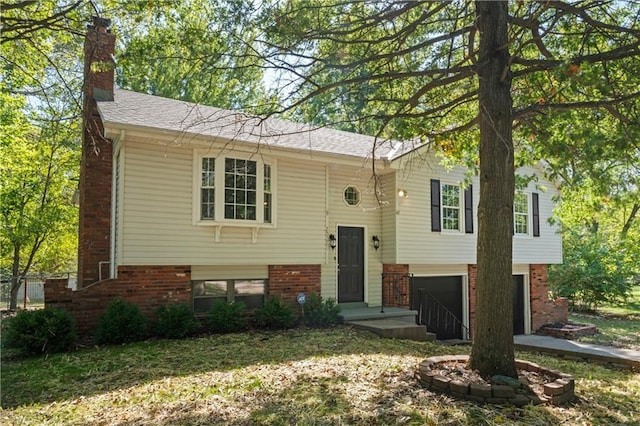 bi-level home featuring a garage