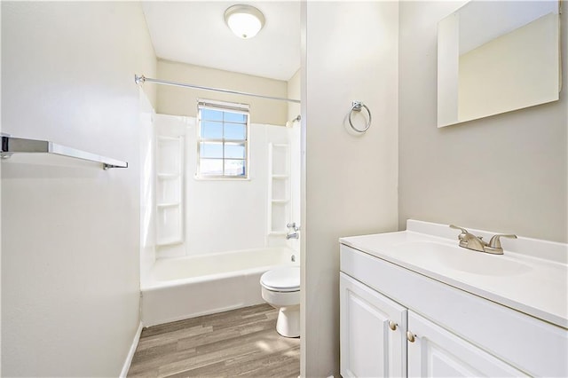 full bathroom with toilet, vanity, hardwood / wood-style flooring, and bathing tub / shower combination