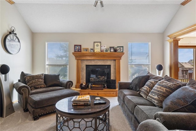 living room featuring light colored carpet, a fireplace, and vaulted ceiling