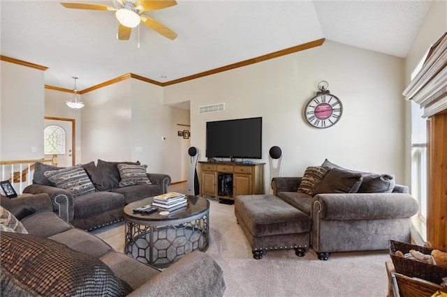 carpeted living room with ceiling fan, lofted ceiling, and ornamental molding