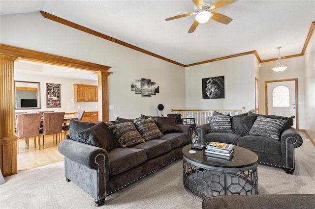 carpeted living room with crown molding, ceiling fan, and vaulted ceiling