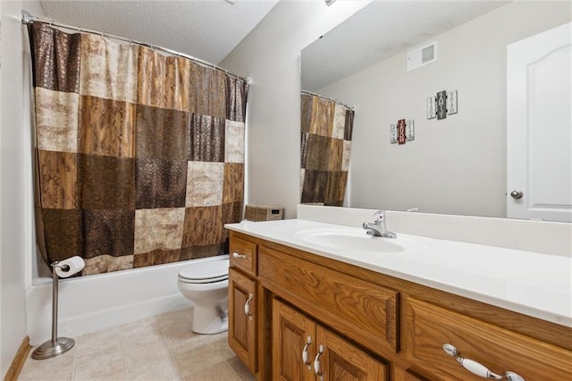 full bathroom featuring shower / bath combo, vanity, a textured ceiling, tile patterned flooring, and toilet