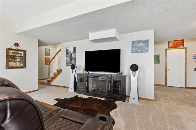 living room with a fireplace, light carpet, and a textured ceiling