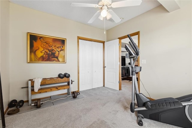 workout room featuring light colored carpet and ceiling fan