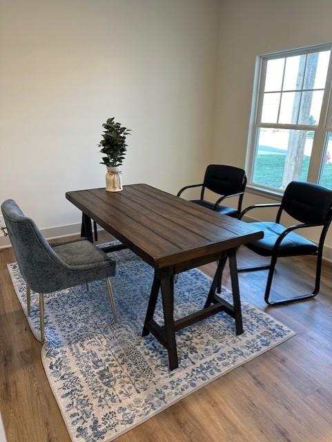 home office with hardwood / wood-style floors