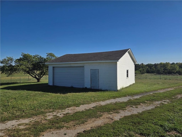 garage featuring a yard