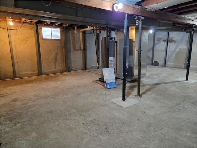 basement with water heater and heating unit