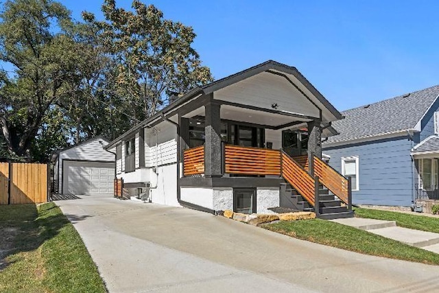 view of front of home with an outbuilding and a garage