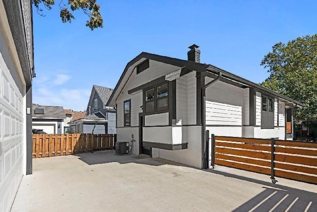 view of property exterior with a patio area and central air condition unit