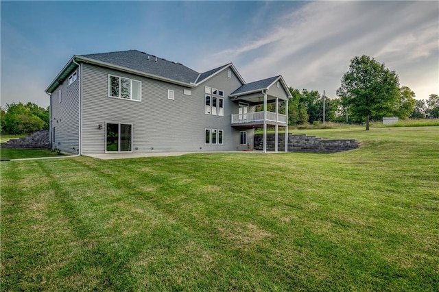 back of house with a yard and a patio area