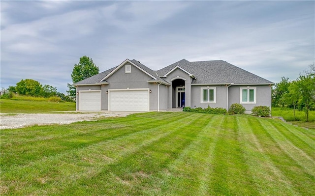 ranch-style home featuring a garage and a front yard