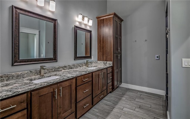 bathroom with vanity and hardwood / wood-style floors