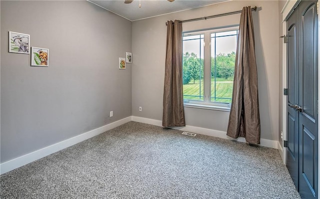 unfurnished room featuring ceiling fan