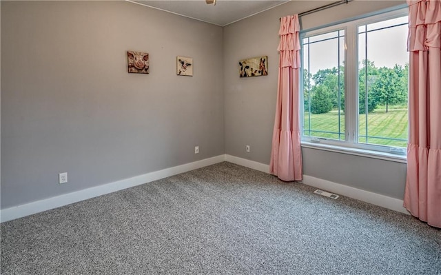 empty room featuring carpet flooring