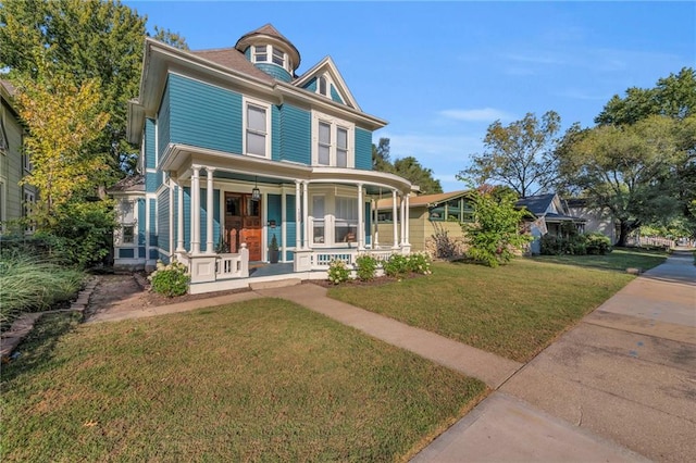 view of front of home with a front lawn and a porch