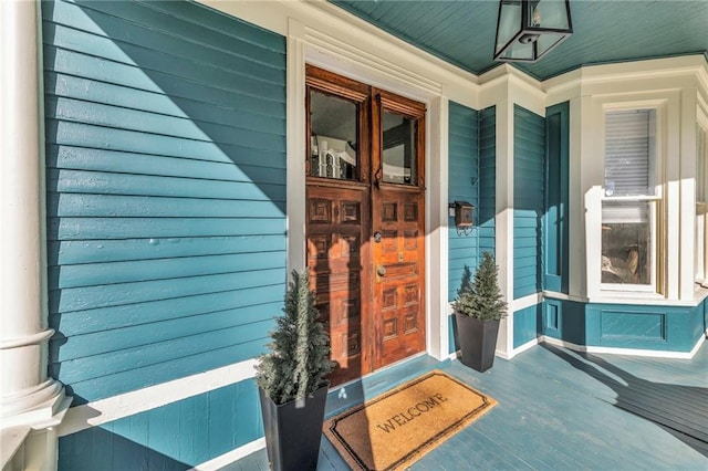 doorway to property featuring covered porch