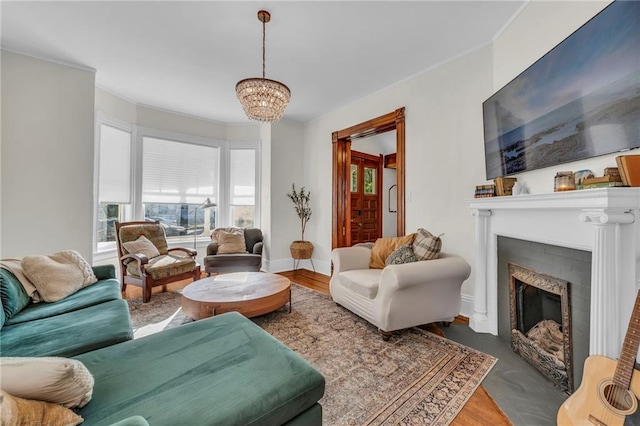 living room featuring an inviting chandelier and dark hardwood / wood-style floors