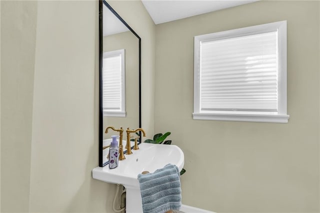 bathroom featuring plenty of natural light and sink