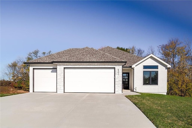 view of front facade with concrete driveway, stone siding, roof with shingles, an attached garage, and a front yard