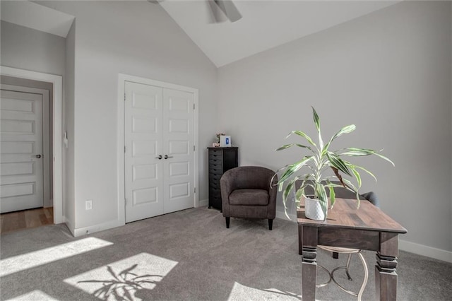 sitting room featuring high vaulted ceiling, baseboards, and carpet flooring