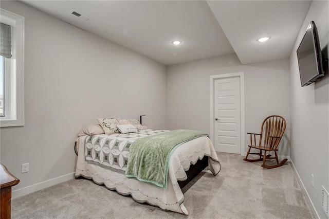 carpeted bedroom featuring recessed lighting, visible vents, and baseboards