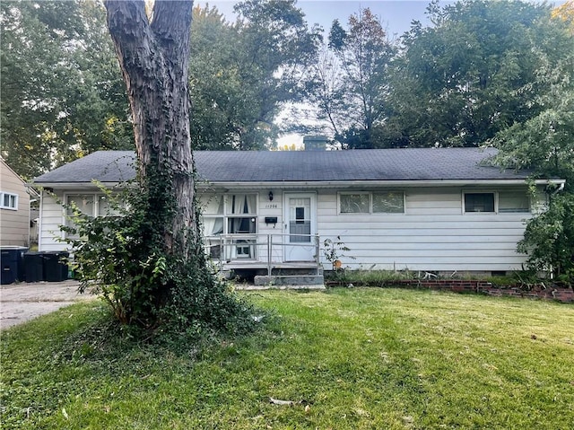 ranch-style home with a front yard