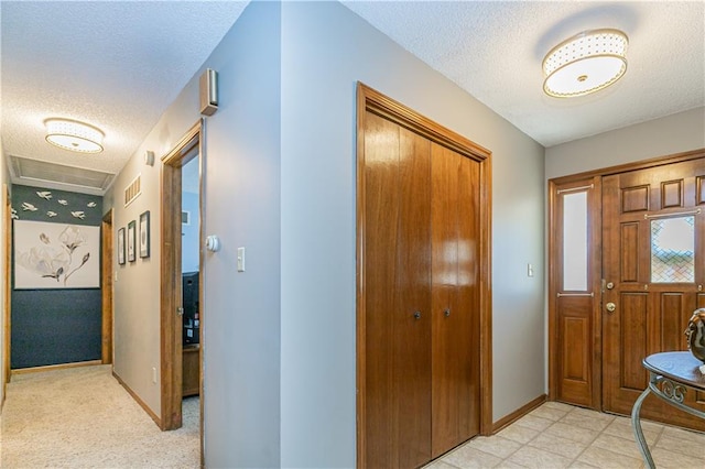 entrance foyer featuring a textured ceiling