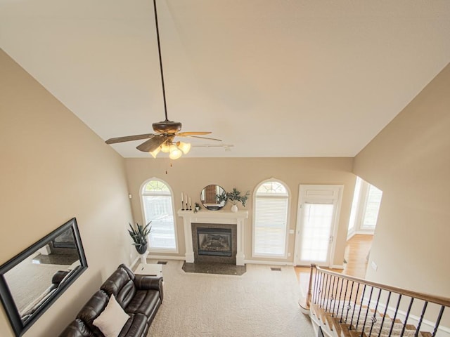 living room featuring ceiling fan and carpet flooring