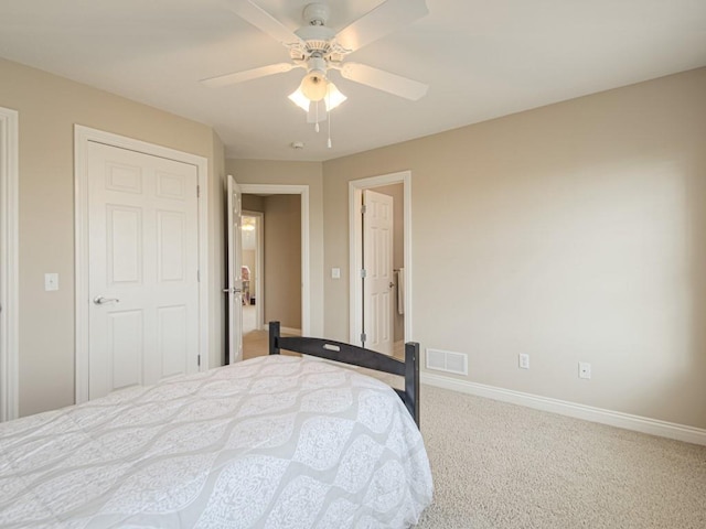 bedroom featuring carpet floors, ceiling fan, and a closet