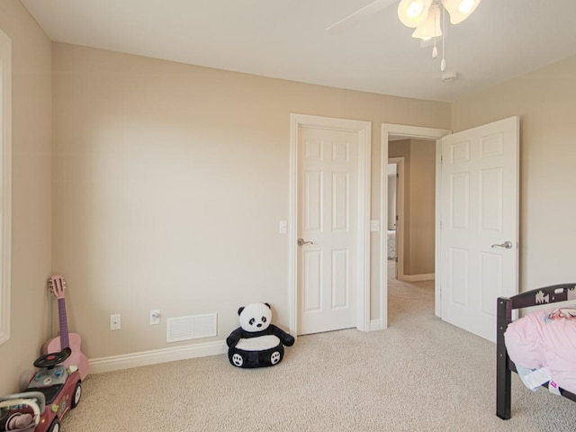 carpeted bedroom with ceiling fan