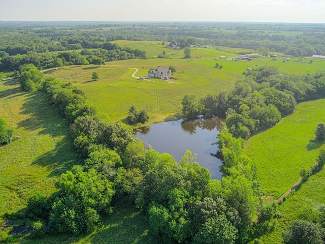 drone / aerial view featuring a water view and a rural view