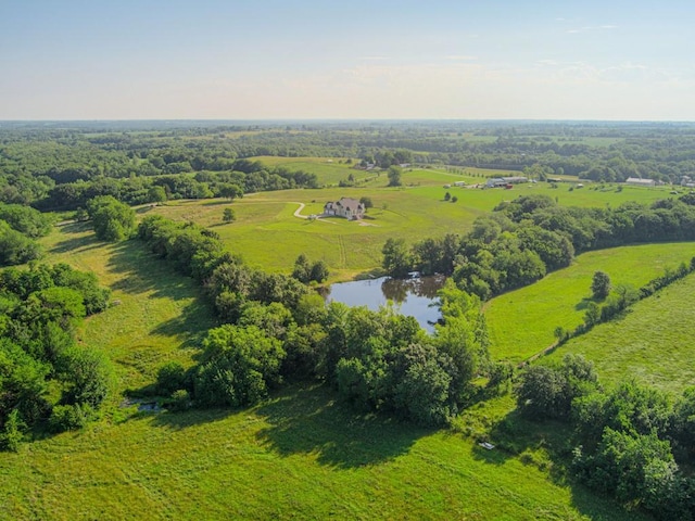 drone / aerial view featuring a water view and a rural view